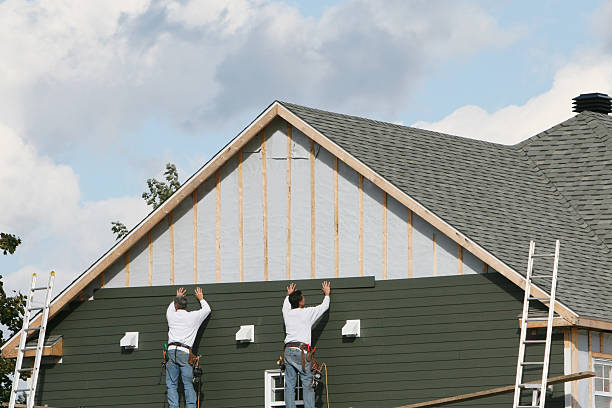 Professional Siding Contractor technician working in Williston Park, NY
